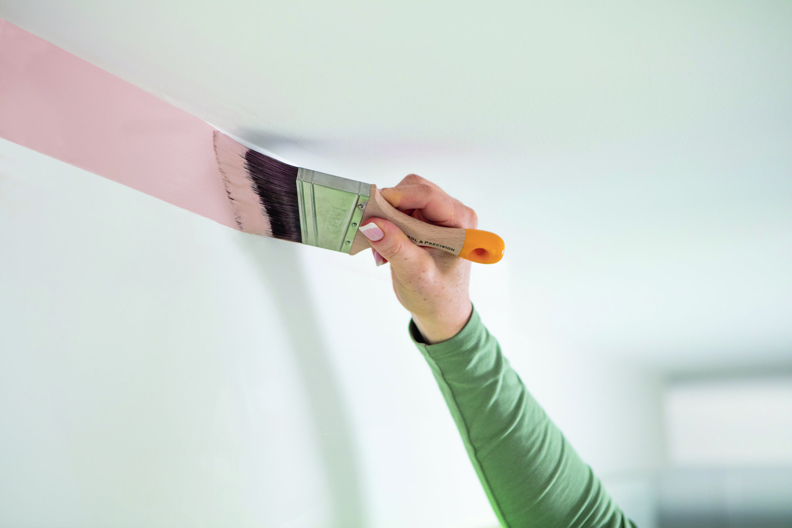 Painting interiors: everything you need to know about preparation and application to set started 

 

When painting the inside of your house, achieving a beautiful finish with ease is the goal. In order to achieve a quality finish, it’s important to be aware of the best way to prepare and paint your space, there are a few steps you need to consider as well as the order in which you go about painting your interior areas. Keep reading to lean more!  
 

Prepare your surfaces

First, you’ll need to prepare your surfaces. This involves sealing gaps between skirting boards, filling in any surface cracks which may be present on the wall and sand them down using Monarch Mini Fill Sand Go. This will ensure a smooth, even surface.  
Wash your surfaces with Sugar Soap to remove any grime or dust. Now you’re ready to paint!
 

Paint the ceilings first

The reason ceilings should be completed first is so you can paint underneath the lip of the cornice. This can be  a tricky area to cover and it will typically result in the paint spreading about 50mm onto the top of the wall. No need to worry – you will cover up this excess paint when you do your walls. 
We recommend using our Cornice & Ceiling Brush, as its triangular head gets into those tough spots well. 

 
Complete your walls one at a time
When the ceiling is finished, it’s time to paint walls. Focus on each wall in isolation when completing the process of both cutting in and rolling.
Cut in the edges using a Cutting In & Framing Brush. The angled head helps you to paint straighter lines with precision while not losing its shape. 
While the edges are still moist, load up your Walls & Ceilings Roller with paint. Using the width of your roller as a guide, tackle your wall in sections. Starting in the mid-section, roll up and down the wall from floor to ceiling a couple of times, to achieve an even, smooth finish.
When you’ve rolled your walls, you’ll noticed that the edges you cut in with the brush have blended together seamlessly. 
 

Finish with your trims
Use your Walls, Doors & Trims Brush to paint your trims, such as doors, window frames and skirting boards, as the final step in your interior room job. 

HANDY TIP – While we all know it’s important to complete at least two coats of paint on the walls, we recommend also doing a first coat on your trims. During this coat, pay attention to getting good coverage on the edges of the trims that touch the walls.

This way, you can then finish the second coat on walls, and then, doing trims last, you don’t have to paint those hard-to-reach trim edges again. This avoids worrying about getting trim paint on the walls by trying to get perfect straight edges.

For more advice on how to select the perfect paint accessory for your next project, take a look at our product finder tool and discover a bunch of painting tips, tricks and inspiration by following us on Instagram and Facebook.
